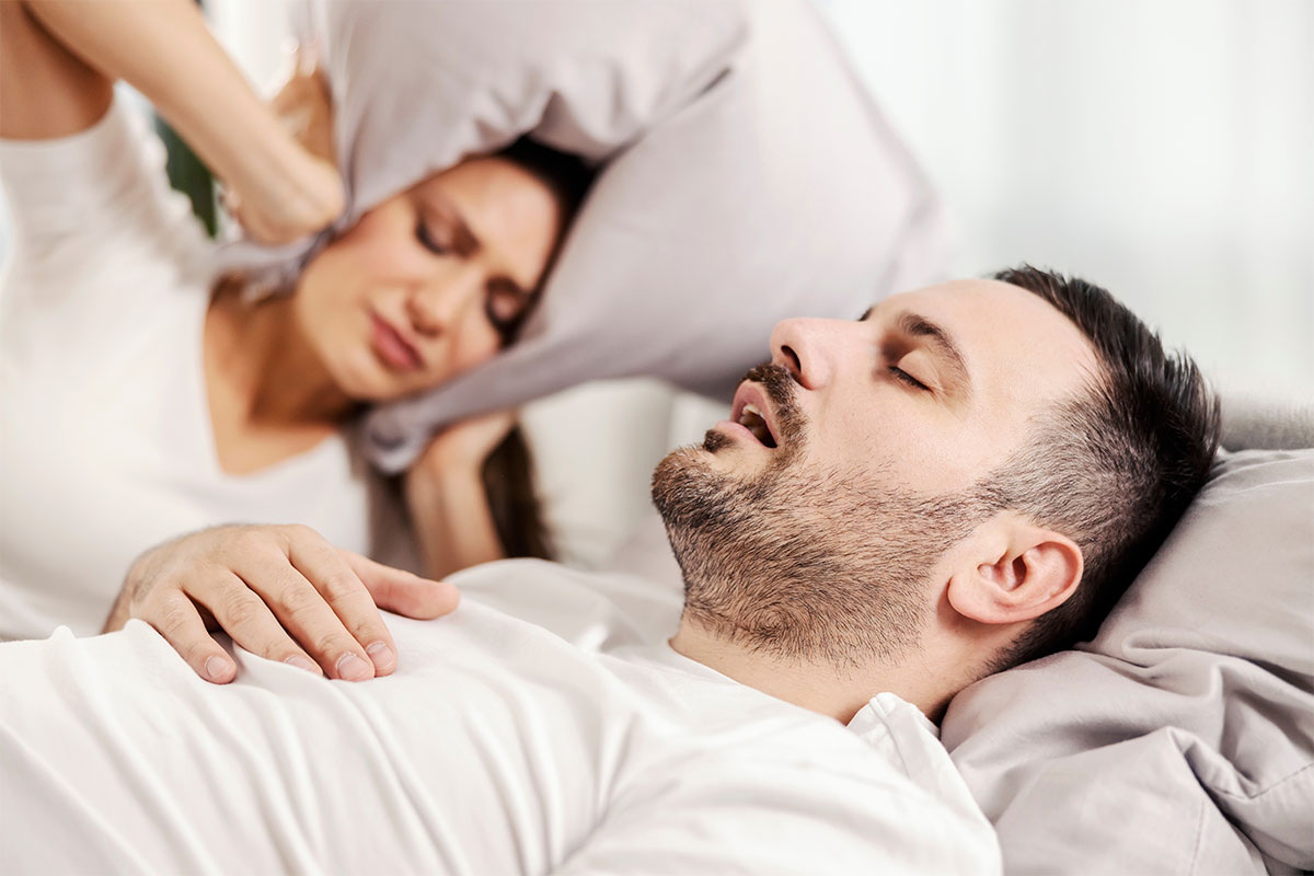 Treatment for Snoring - Couple in Bed