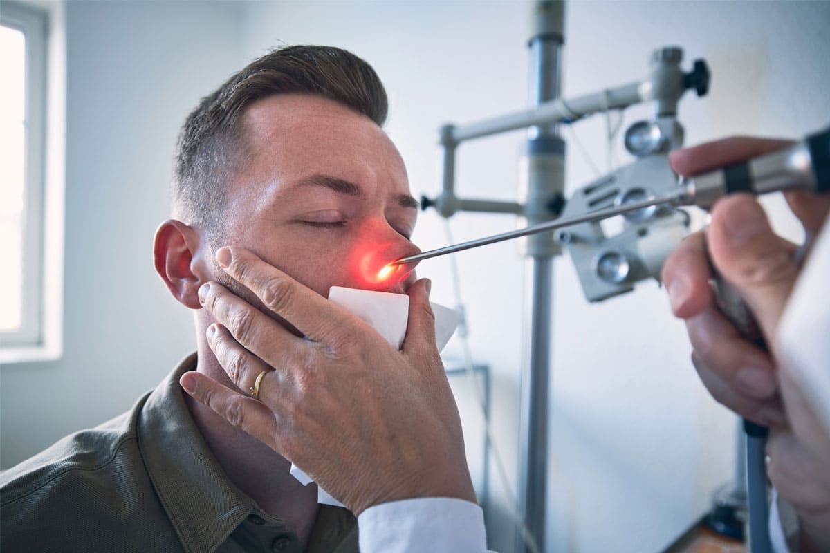 Medical professional performing a snoring laser treatment